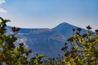 Scenic view of mountains against clear blue sky