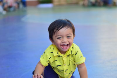 Portrait of smiling boy in swimming pool