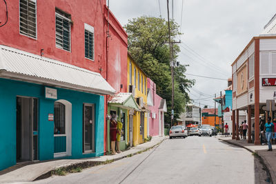 Street amidst buildings in city against sky