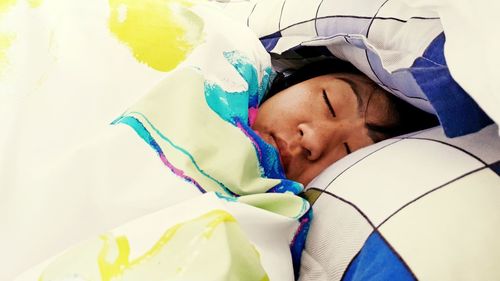 High angle view portrait of baby sleeping