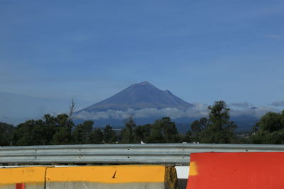 Scenic view of landscape against blue sky