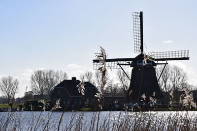 Traditional windmill against sky