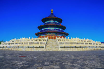 View of historical building against clear blue sky