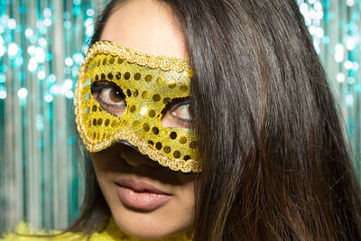 Close-up portrait of young woman wearing mask