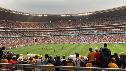 Group of people on soccer field