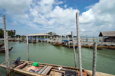 Boats moored at harbor