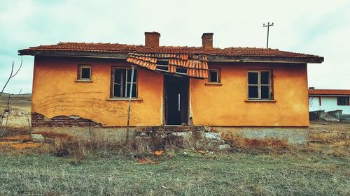 Abandoned house against sky