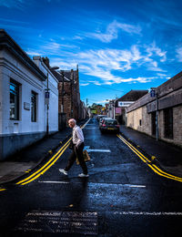 People walking on road in city