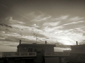 Low angle view of built structure against cloudy sky