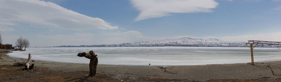 Scenic view of sea against sky during winter