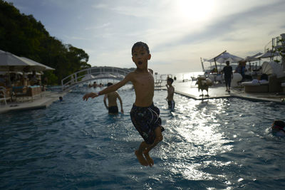 Full length of young man swimming in sea