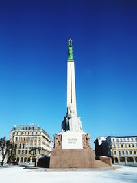 Low angle view of statue against sky