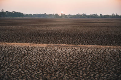 Scenic view of field against sky during sunset