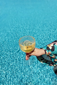 High angle view of woman holding drink