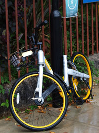 Bicycle parked by metal structure