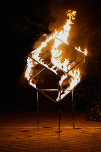 Low angle view of fire on floor at night