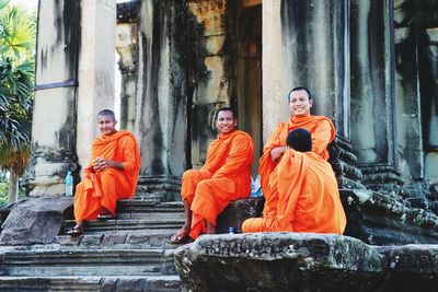 People sitting outside building