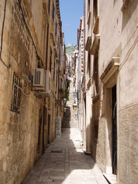 Narrow alley amidst buildings in town