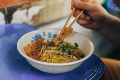 Close-up of hand holding food