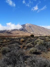 Scenic view of volcanic landscape against sky