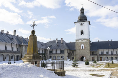 View of buildings against sky during winter