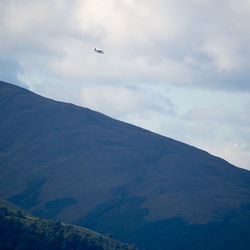 Low angle view of airplane flying in sky