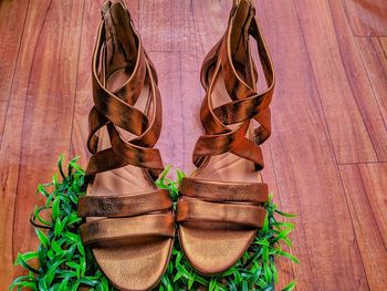 High angle view of shoes on hardwood floor