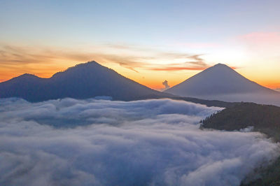 Scenic view of mountains against sky during sunset