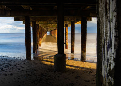 Pier over sea against sky