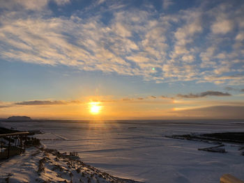 Scenic view of sea against sky during sunset