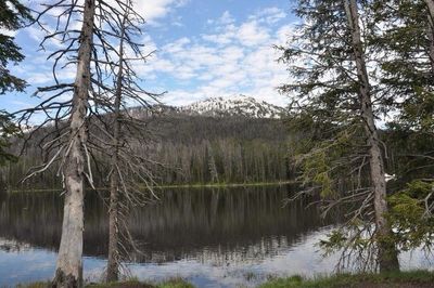 Scenic view of lake with mountains in background