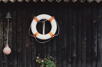 Life belt on wooden wall