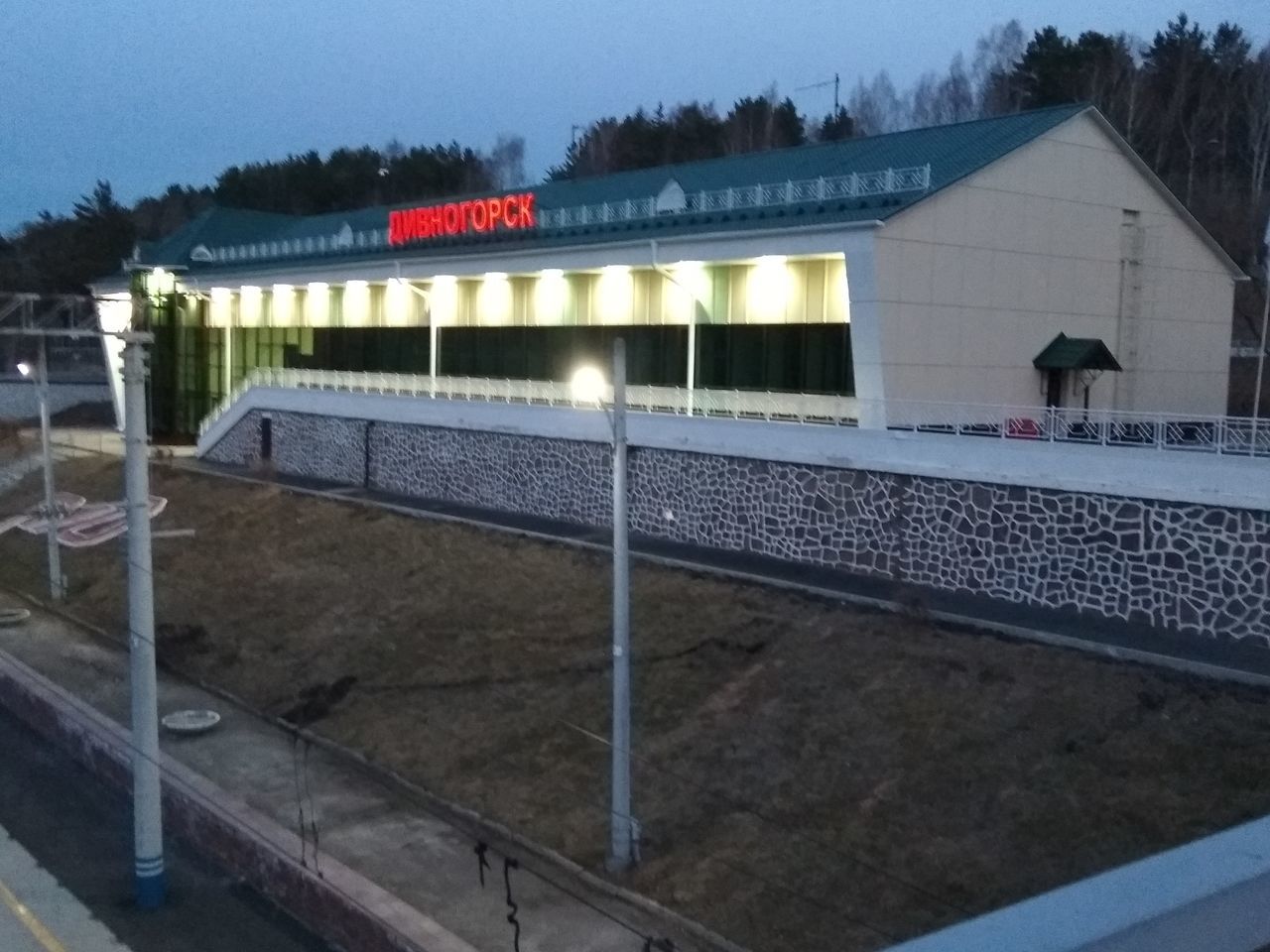 ILLUMINATED BUILDING AGAINST SKY AT DUSK