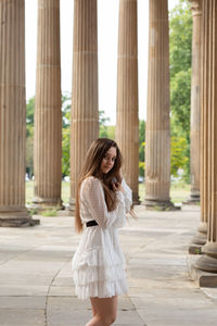 Full length of young woman looking at camera