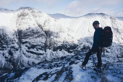 Man standing on snow covered mountain
