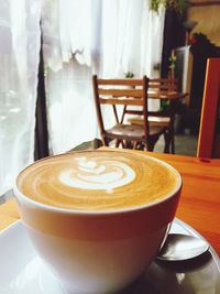 Close-up of coffee cup on table