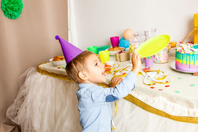 Cute girl with toy toys at home