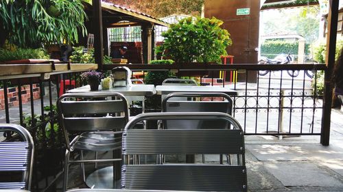 Empty chairs and tables in cafe