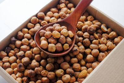 High angle view of peanuts in container