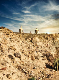 Scenic view of rocks on land against sky