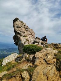 Low angle view of rock against sky