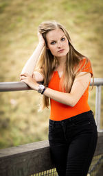 Portrait of a beautiful young woman standing outdoors