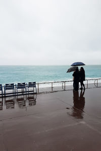 Man on beach against sky