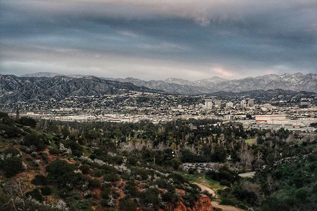 mountain, sky, mountain range, building exterior, cloud - sky, architecture, built structure, landscape, scenics, cloudy, high angle view, cloud, house, nature, beauty in nature, residential structure, tranquil scene, tree, tranquility, residential district