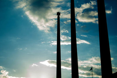 Low angle view of silhouette pole against sky