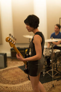 Young musicians practicing at a rehearsal space