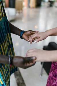 Couple holding hands while standing at banquet