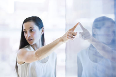 Businesswoman giving presentation in meeting at conference room