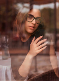 Portrait of young woman in sunglasses