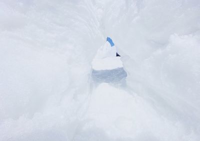 Person skiing on snowcapped mountain